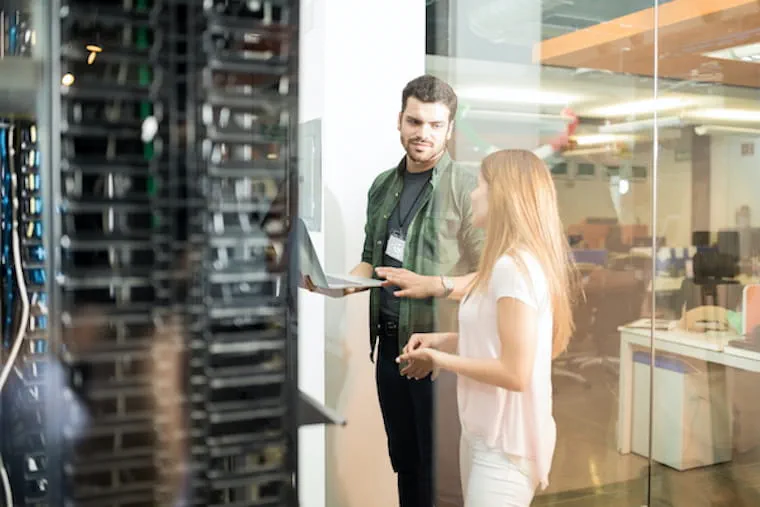 Two people in data center