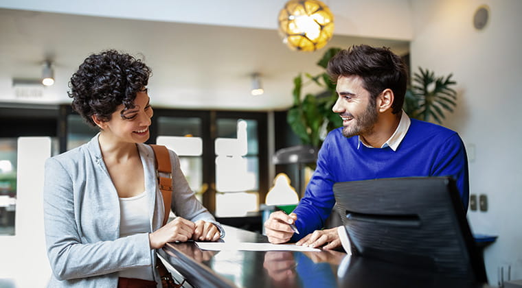 People reviewing hospitality paperwork