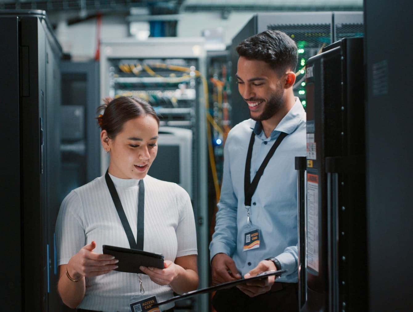 Two people looking at a clipboard in a warehouse