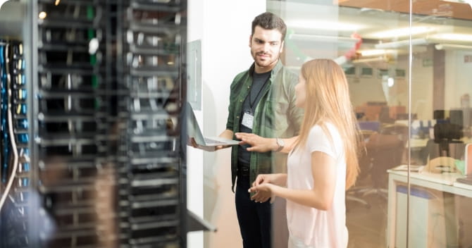 Two people in data center