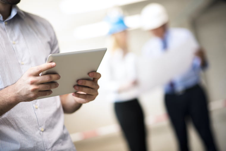 Person onsite reading tablet