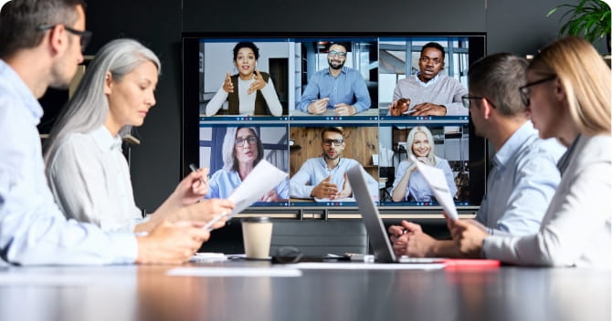 People in a conference room on a video call