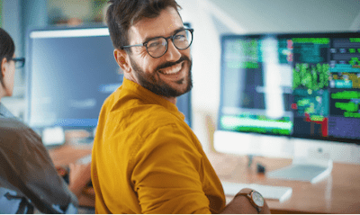 A larger monitor with a person in front of it
